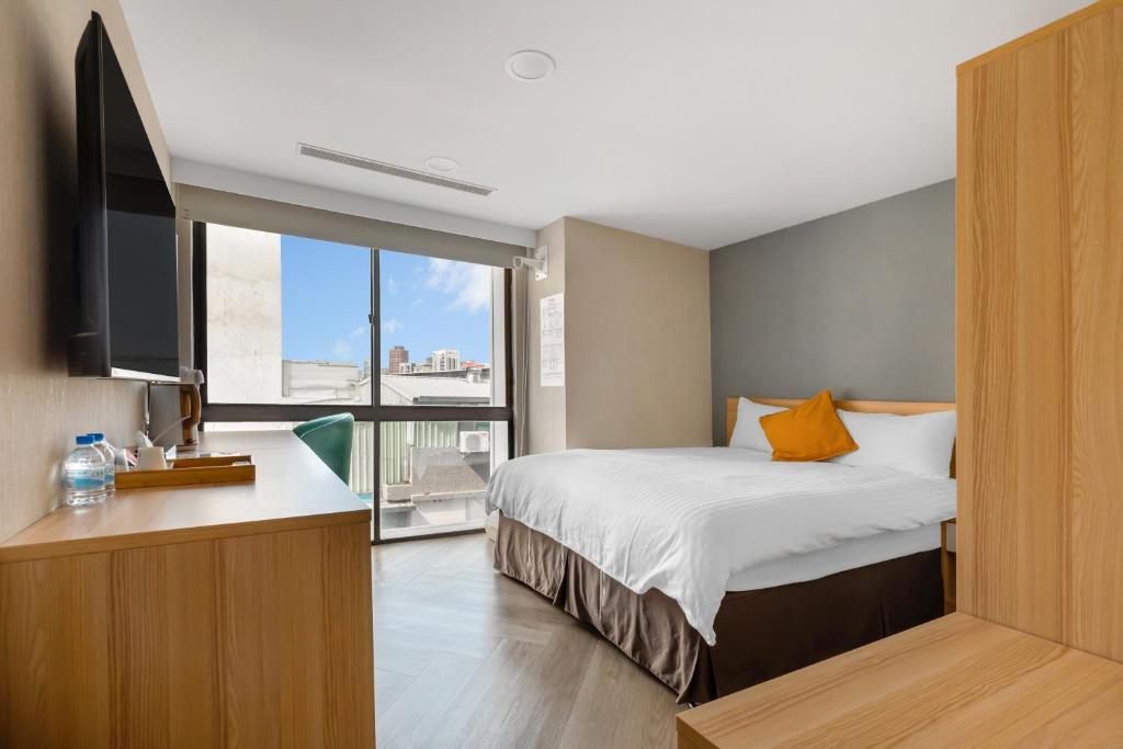 Postel nebo postele na pokoji v ubytování Mu Chen Hotel