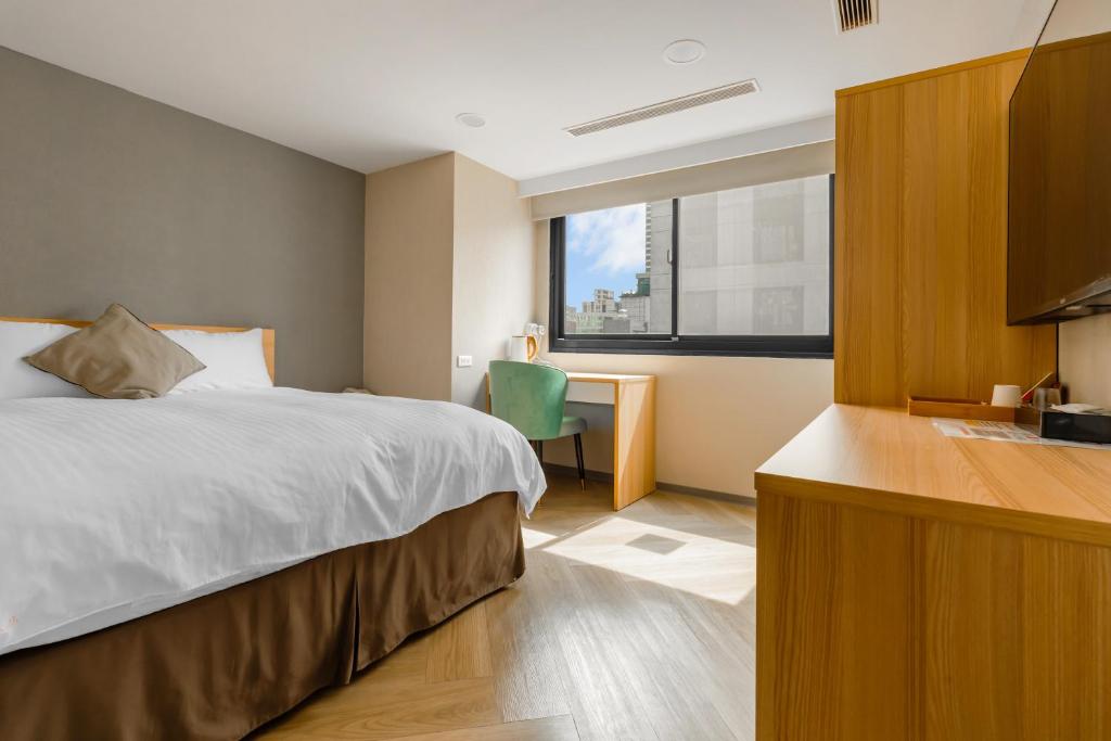 Postel nebo postele na pokoji v ubytování Mu Chen Hotel
