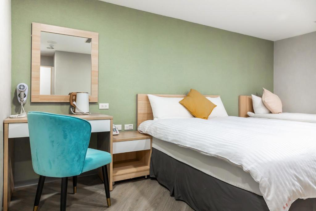 Postel nebo postele na pokoji v ubytování Mu Chen Hotel