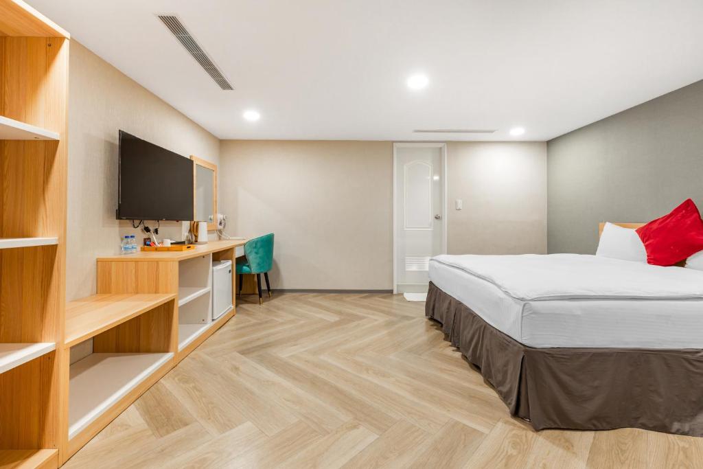 Postel nebo postele na pokoji v ubytování Mu Chen Hotel