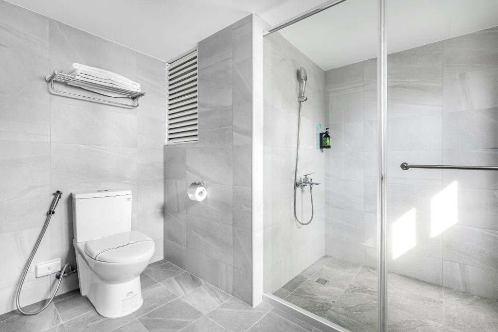 Koupelna v ubytování Mu Chen Hotel