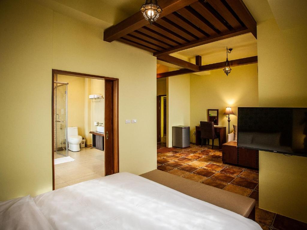 Postel nebo postele na pokoji v ubytování Oasis Hotel