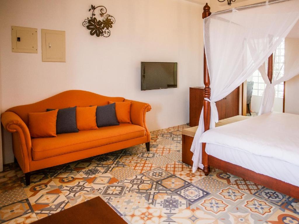 Postel nebo postele na pokoji v ubytování Oasis Hotel