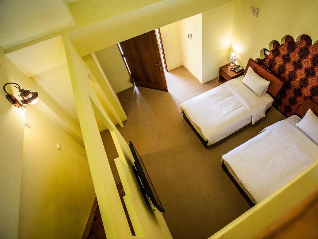Postel nebo postele na pokoji v ubytování Oasis Hotel