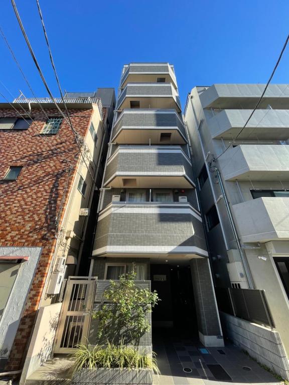 an apartment building in the city of melbourne at T-Hotel 浅草 in Tokyo