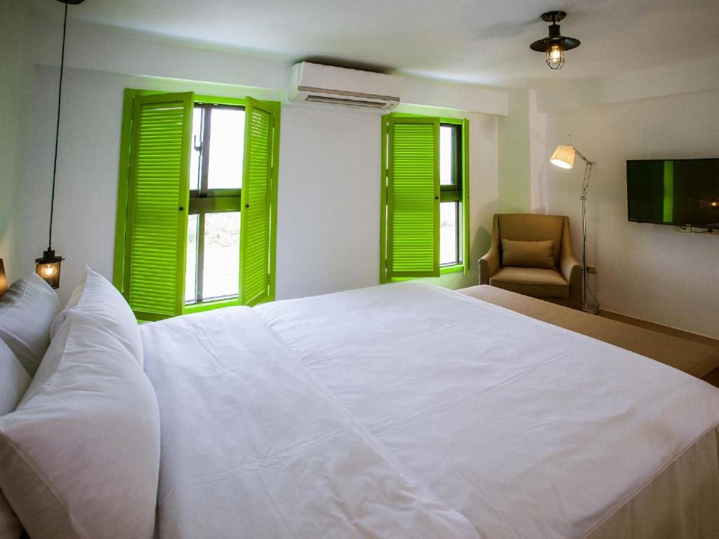Postel nebo postele na pokoji v ubytování Oasis Hotel