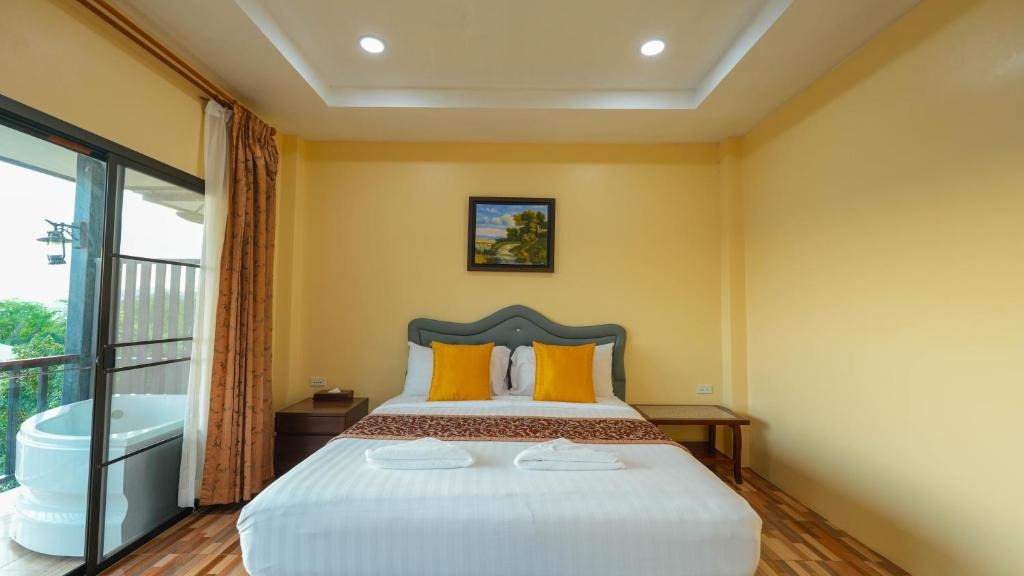 Postel nebo postele na pokoji v ubytování So View Phuket Resort