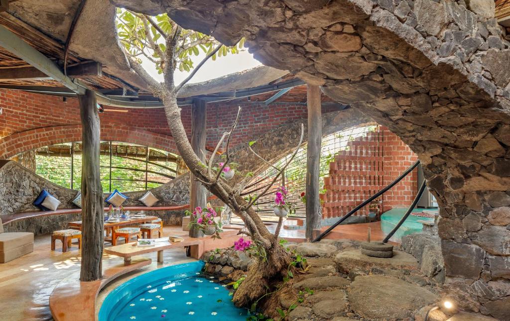 View of SaffronStays Terracotta Trails - 2BR eco-luxury villa with earthy ...