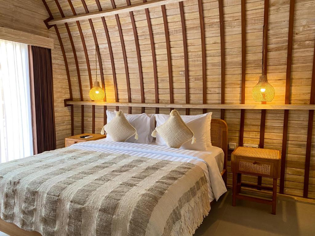 Postel nebo postele na pokoji v ubytování Ratan Uluwatu Hotel and Villas