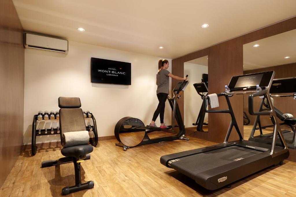 a woman standing on a treadmill in a gym at Hôtel Mont-Blanc Chamonix in Chamonix