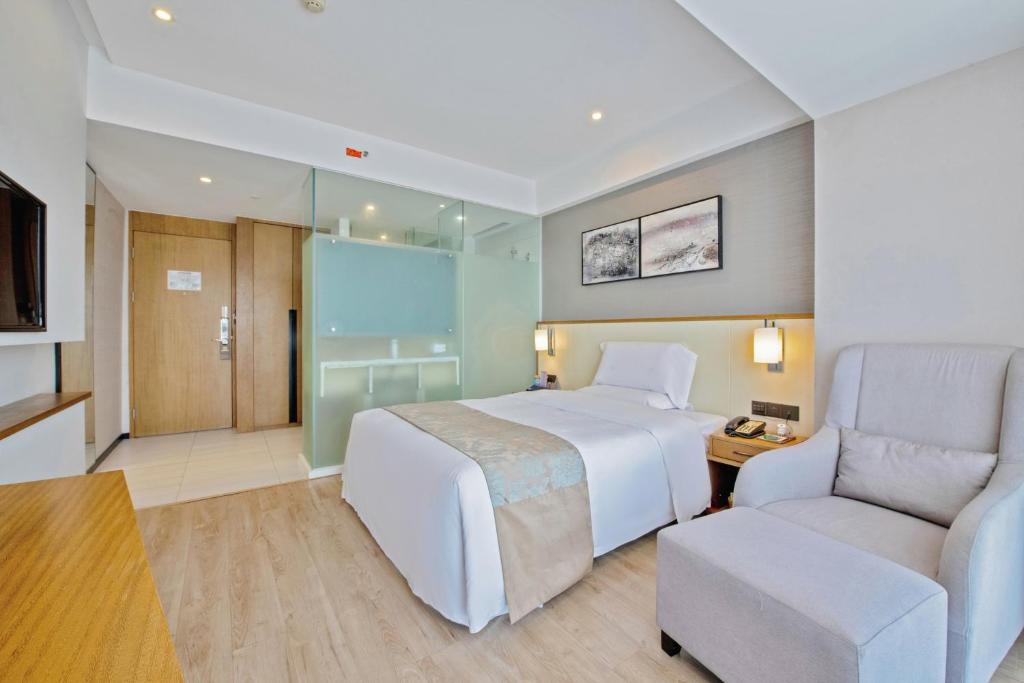 Postel nebo postele na pokoji v ubytování Hongdu Hotel