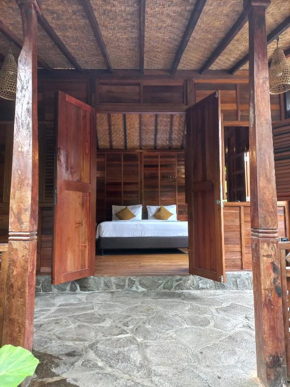 Postel nebo postele na pokoji v ubytování Mahayana Guest House