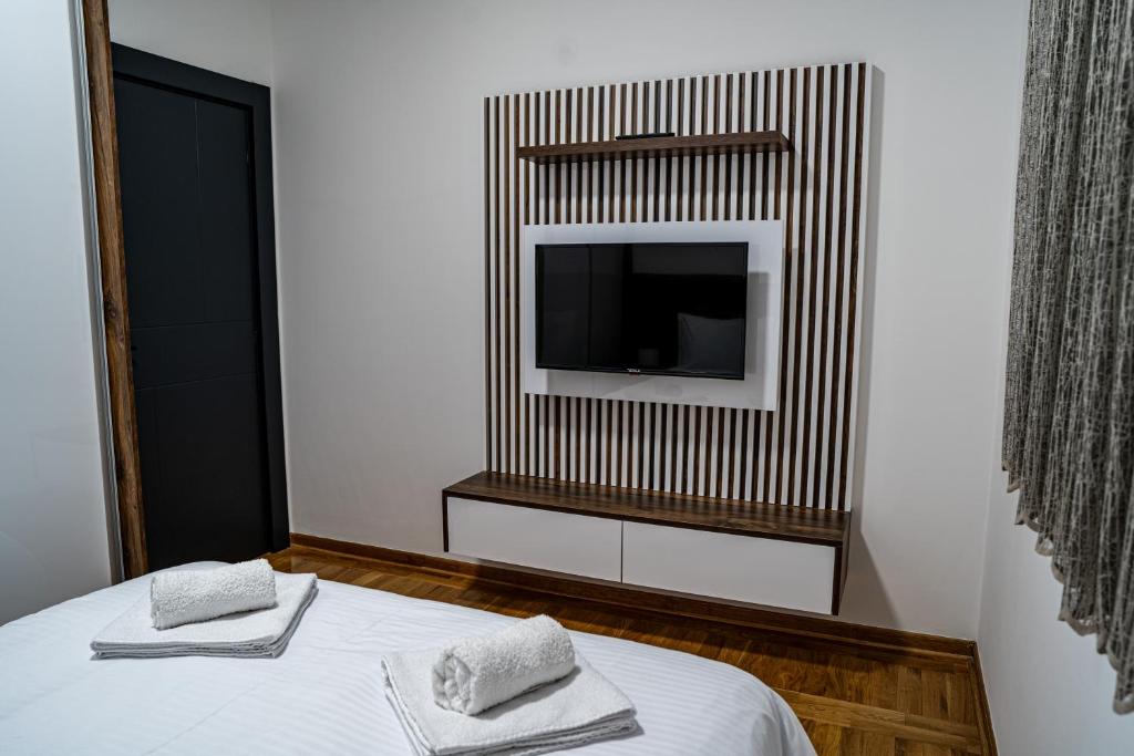 Postel nebo postele na pokoji v ubytování Brilijant Apartman