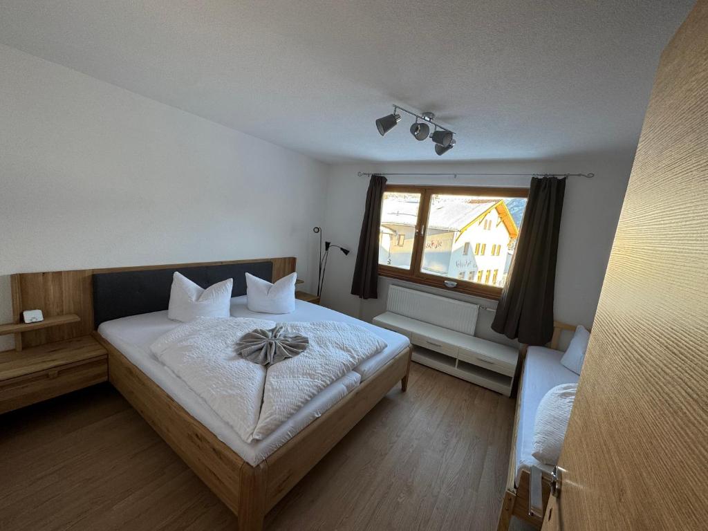 Postel nebo postele na pokoji v ubytování Apart Weitblick Suite