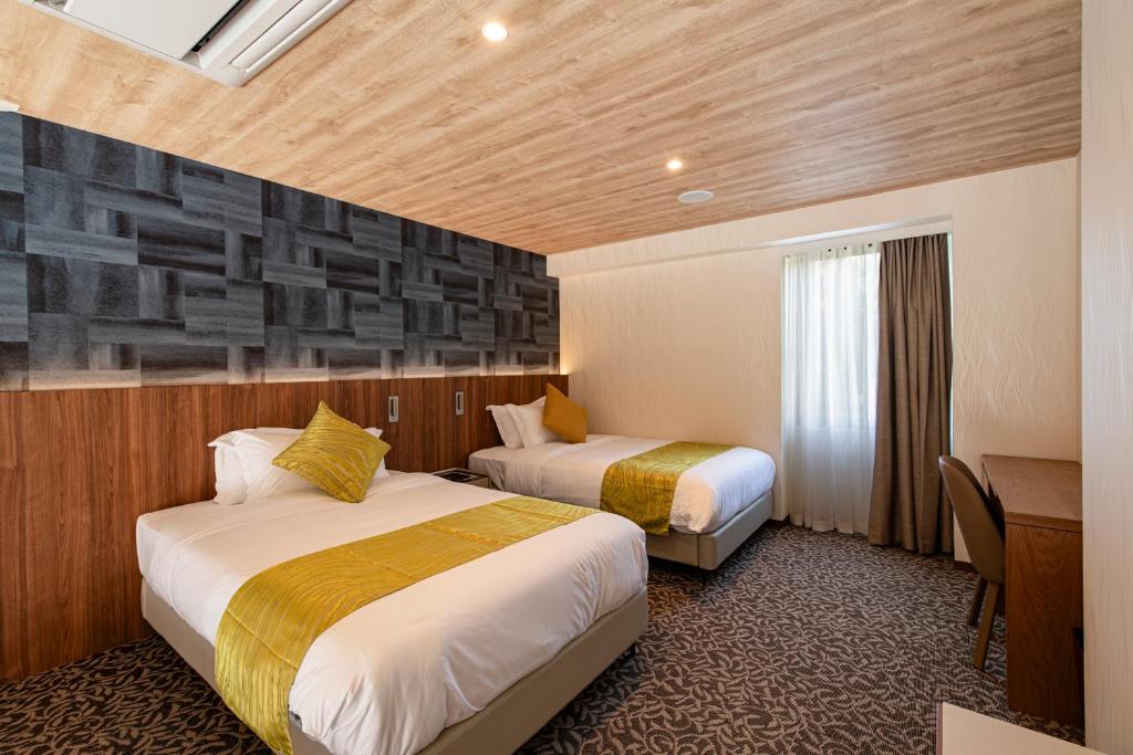 Postel nebo postele na pokoji v ubytování UE Garden Resort