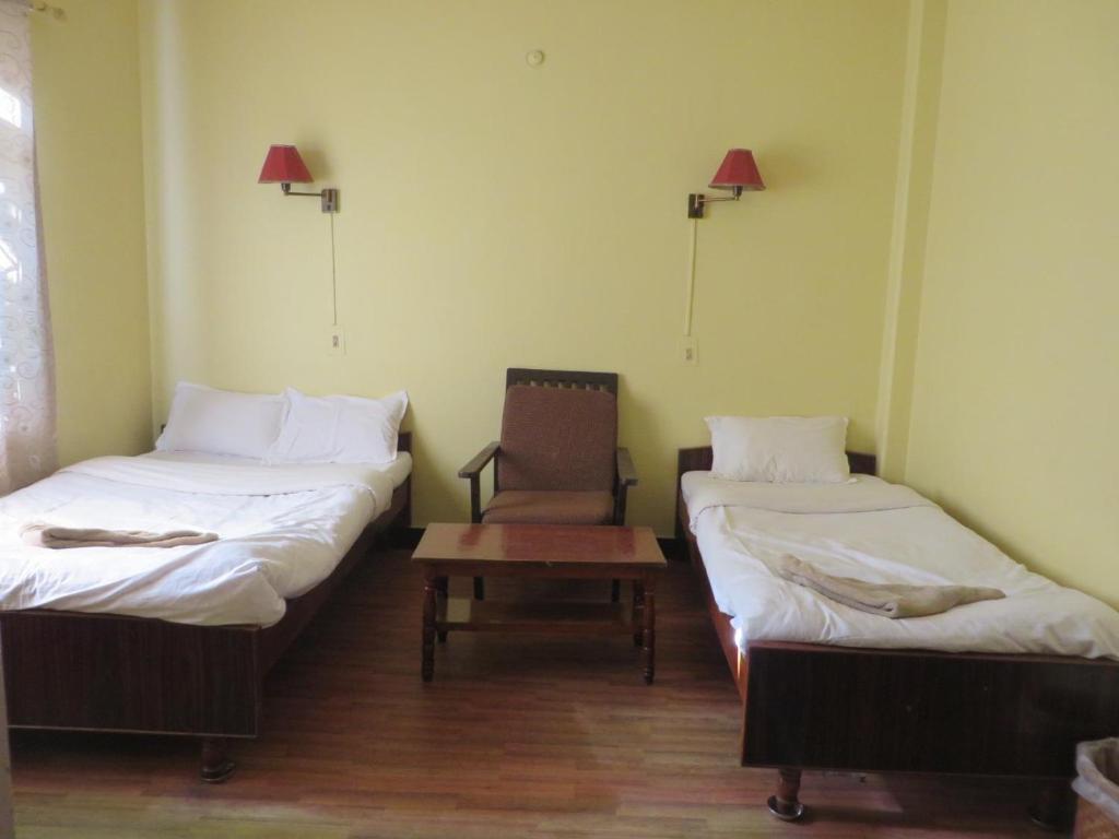 Voodi või voodid majutusasutuse New United Hotel toas