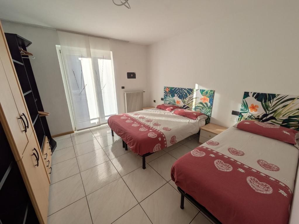 Postel nebo postele na pokoji v ubytování Apartments Giovannini