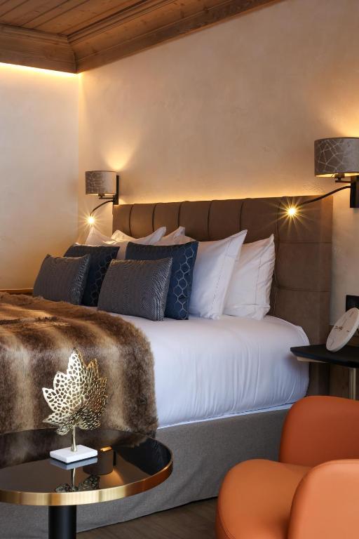 Domaine de Montagne - Hôtel Chalet Frère Josephにあるベッド
