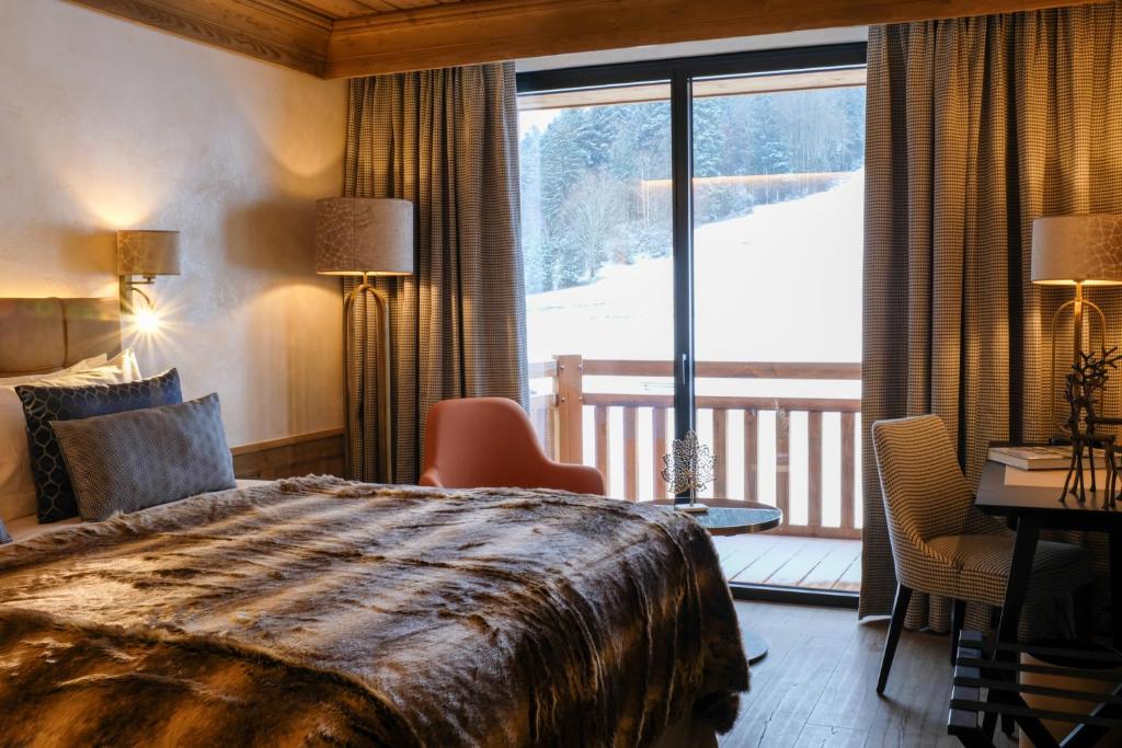 Domaine de Montagne - Hôtel Chalet Frère Josephにあるベッド