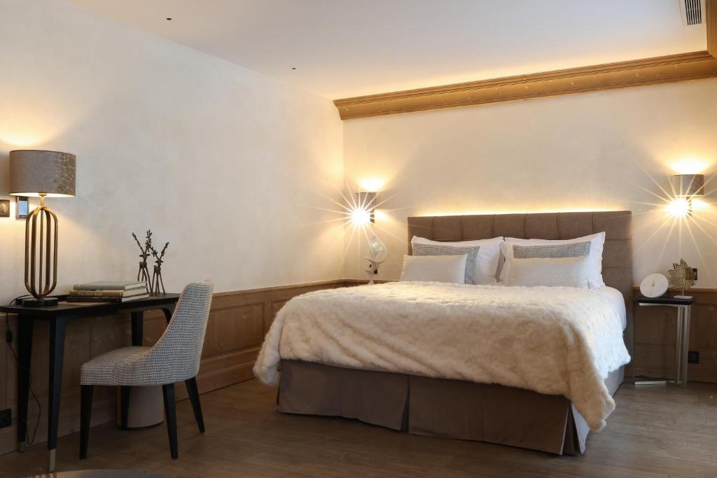 Domaine de Montagne - Hôtel Chalet Frère Josephにあるベッド