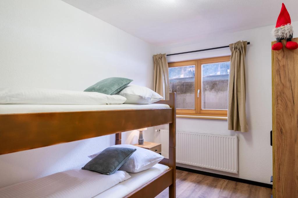Postel nebo postele na pokoji v ubytování Chalet am Lechweg