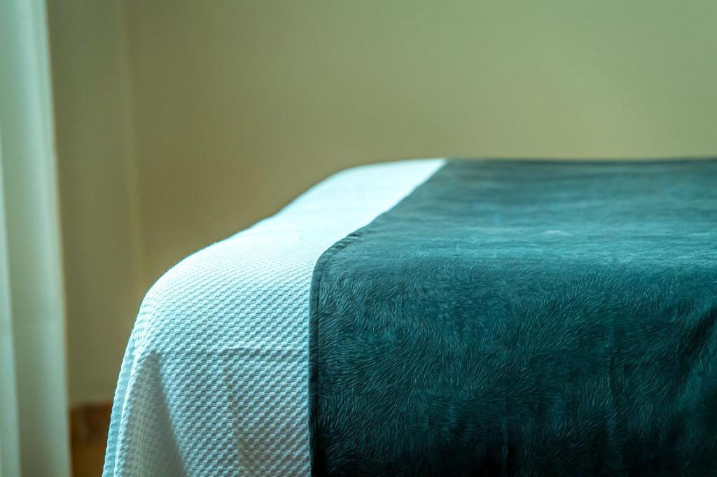 Postel nebo postele na pokoji v ubytování Hotel Tharsis