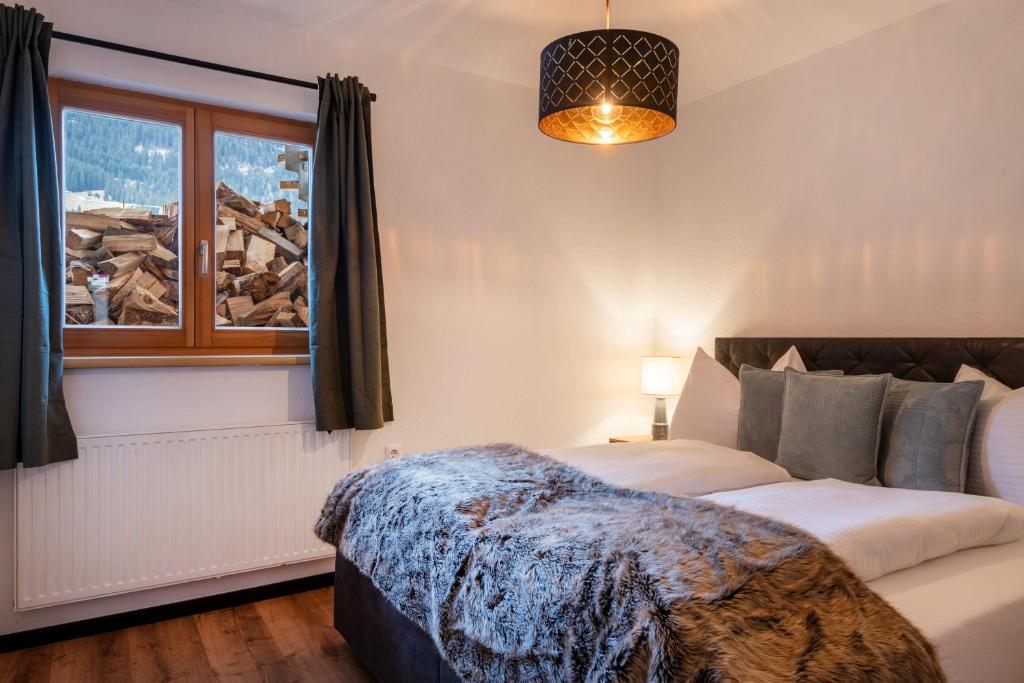 Postel nebo postele na pokoji v ubytování Chalet am Lechweg