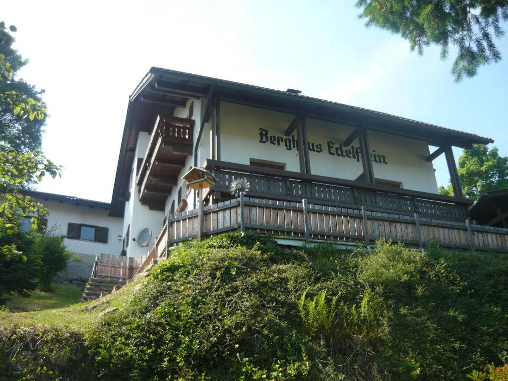 a building with a sign on the side of it at Berghaus Edelstein in Bodenmais in Bodenmais