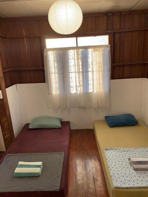 Postel nebo postele na pokoji v ubytování Ka Prao Kai Hostel