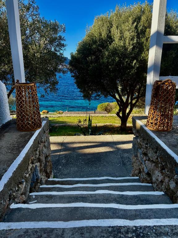 a set of stairs with a view of the water at Armeos Blue in Myrties