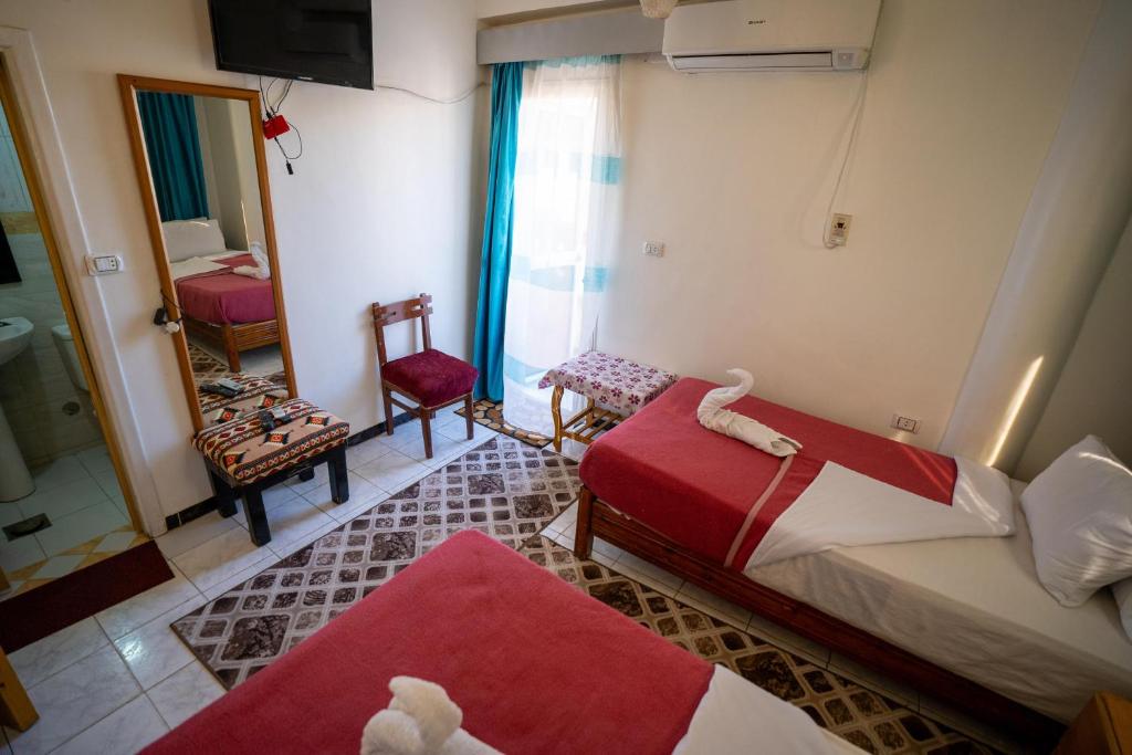 Postel nebo postele na pokoji v ubytování Venus Hotel Luxor 日本人 大歓迎