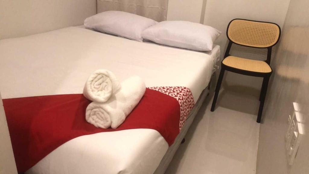 Postel nebo postele na pokoji v ubytování OYO 1128 Hotel Sangco