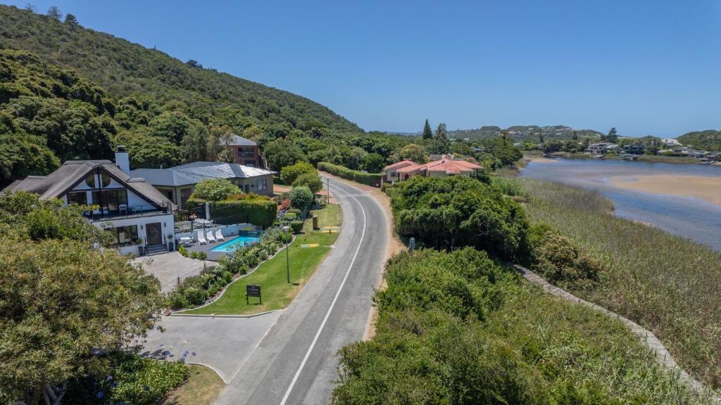 an aerial view of a house next to a river at Cloverleigh Guest House in Wilderness