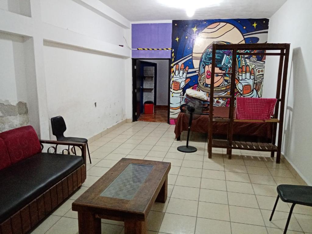 a living room with a couch and a table at Anli in Tonalá