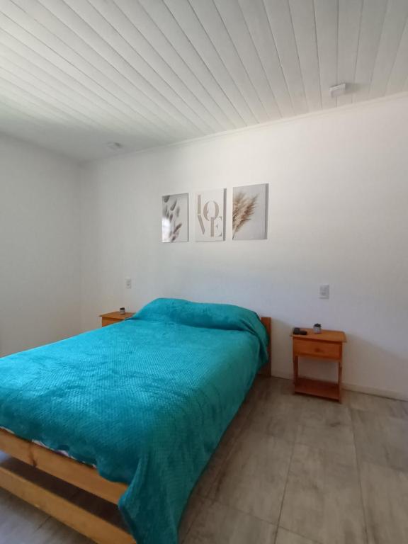Ένα ή περισσότερα κρεβάτια σε δωμάτιο στο Casa acogedora parque playa