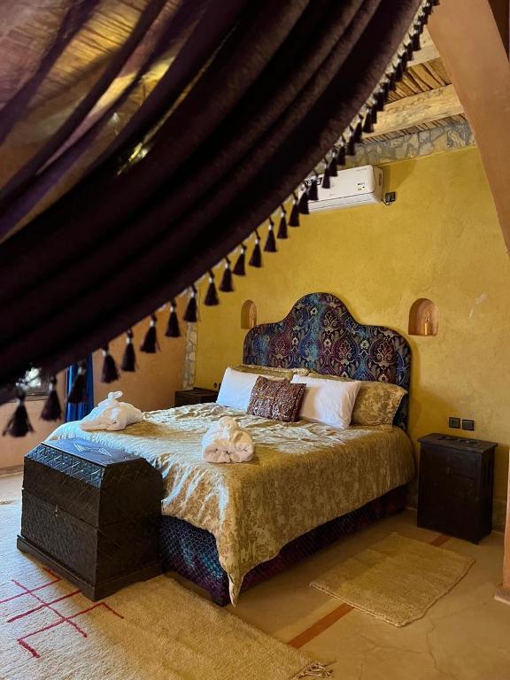 Een bed of bedden in een kamer bij Palais D'Ouzoud