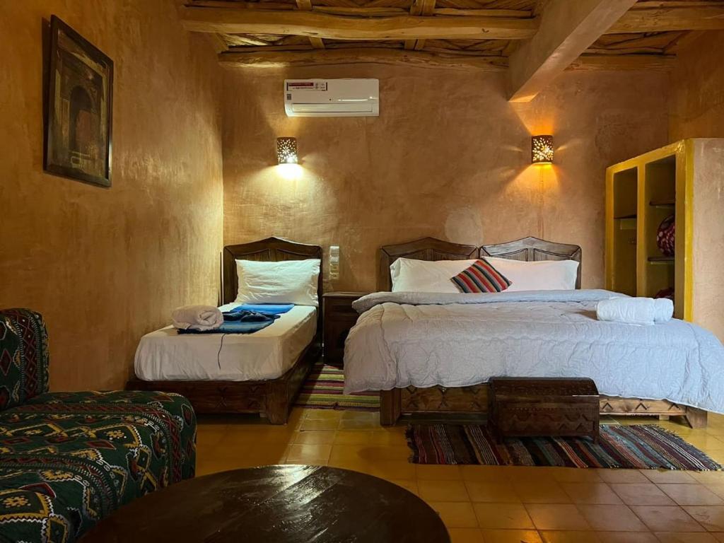 Een bed of bedden in een kamer bij Palais D'Ouzoud
