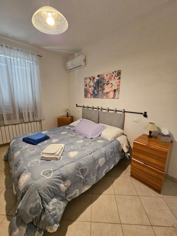Postel nebo postele na pokoji v ubytování Le Casette di Prissy