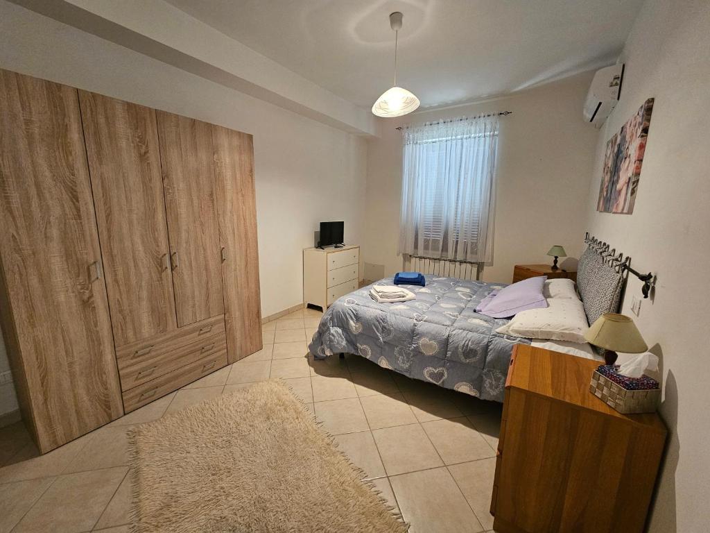 Postel nebo postele na pokoji v ubytování Le Casette di Prissy