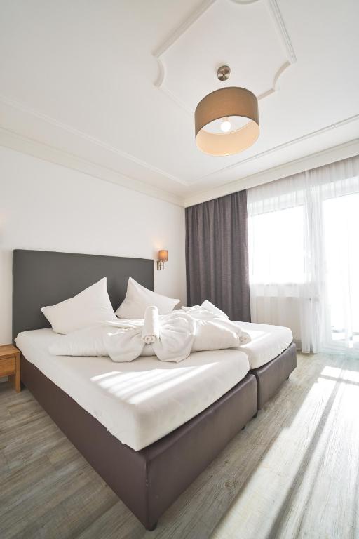 Postel nebo postele na pokoji v ubytování Hotel Gamshag