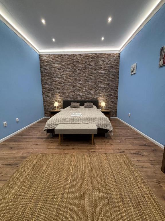 Ένα ή περισσότερα κρεβάτια σε δωμάτιο στο Benny & Bella Apartman City