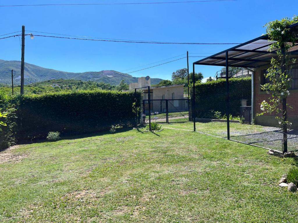 a view from the backyard of a house at Cabaña Abuela Ana in La Falda