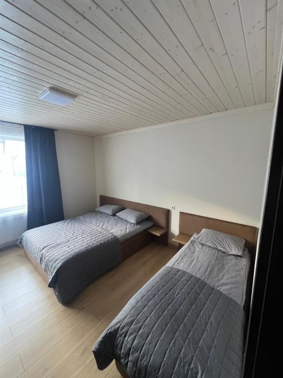 Postel nebo postele na pokoji v ubytování U Stozi Hotel
