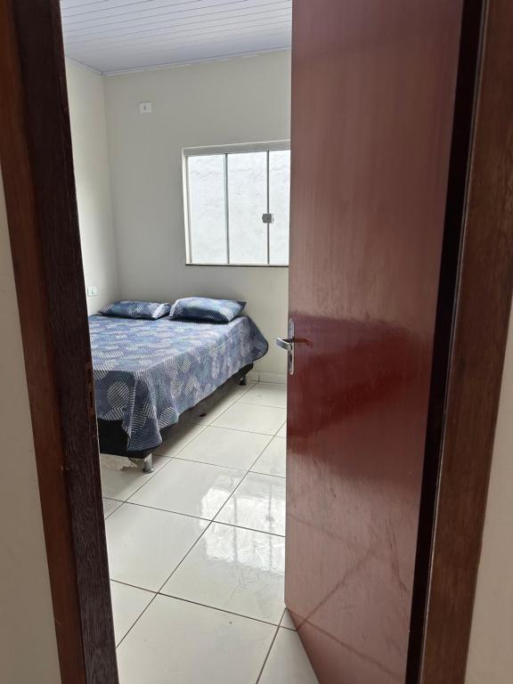 Postel nebo postele na pokoji v ubytování Casa com dois quartos e piscina em mineiros