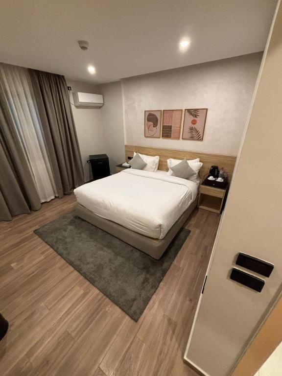 Postel nebo postele na pokoji v ubytování Lacasa Residence