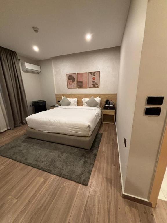 Postel nebo postele na pokoji v ubytování Lacasa Residence