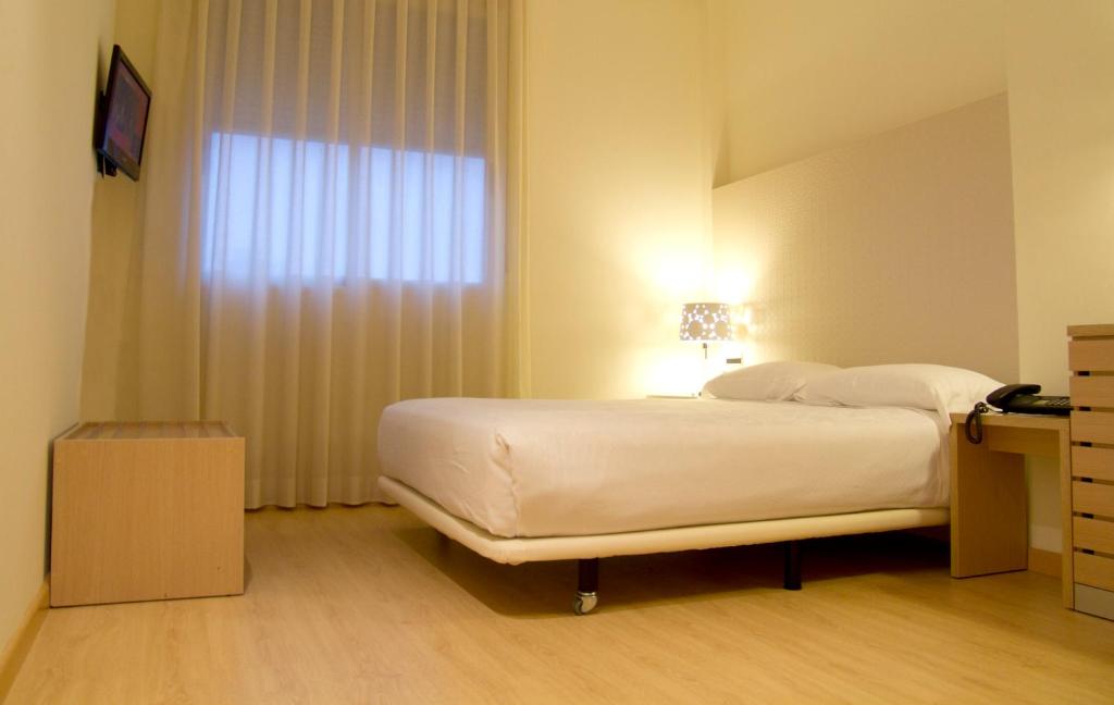 Postel nebo postele na pokoji v ubytování Checkin Valencia Ciscar