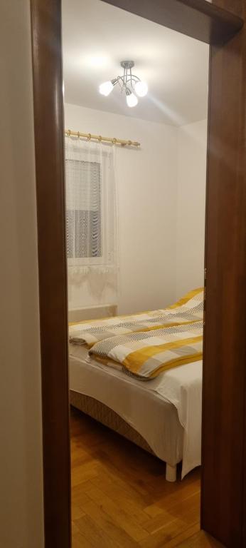 Postel nebo postele na pokoji v ubytování Apartman Bor