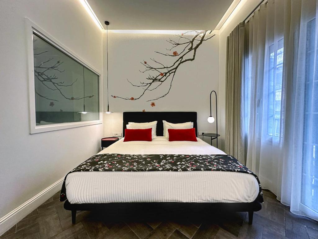 Postel nebo postele na pokoji v ubytování 10 Stories Hotel