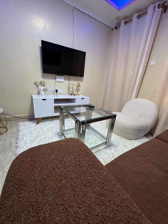 TV a/nebo společenská místnost v ubytování Solange homes